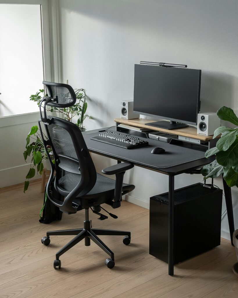 Mesh ergonomic study chair with lumbar support near a computer desk