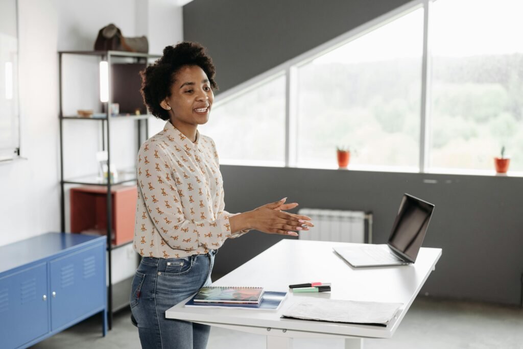 Person working at an affordable standing desk in a clean modern workspace